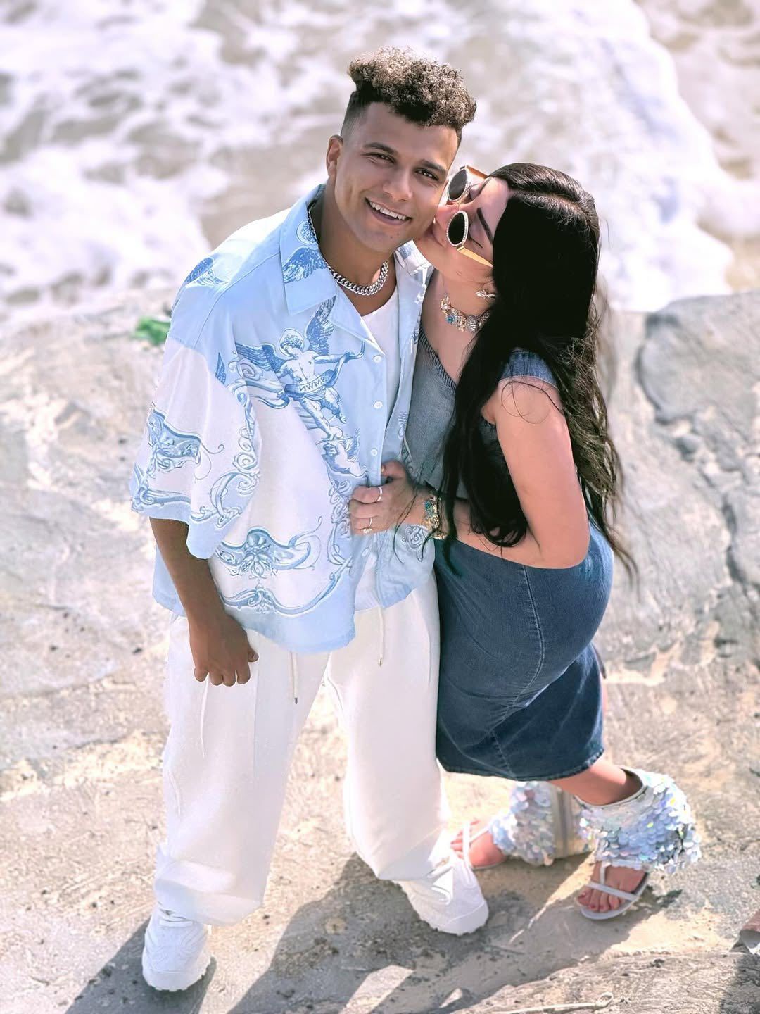 May be an image of 2 people, people smiling and ocean